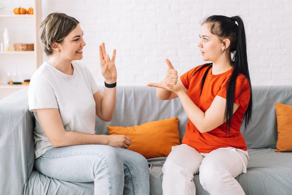 Girl asking for help in sign language